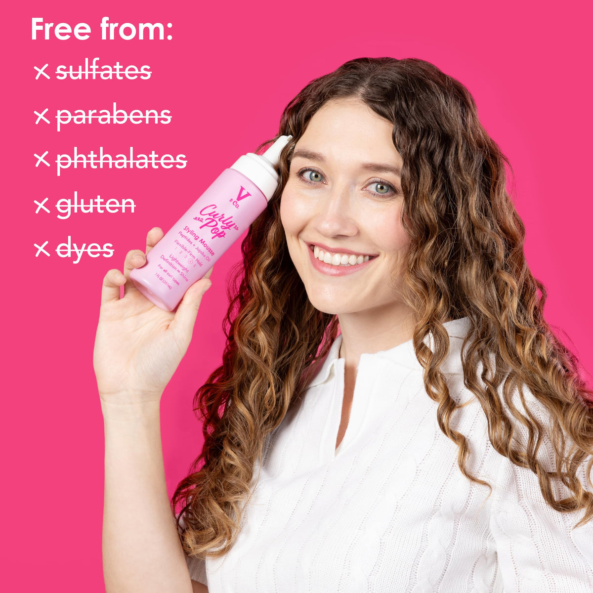 V&CO applied on curly hair showing defined, frizz‑controlled curls