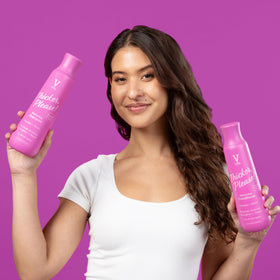 V&Co shampoo pouring into hand in shower for hydration