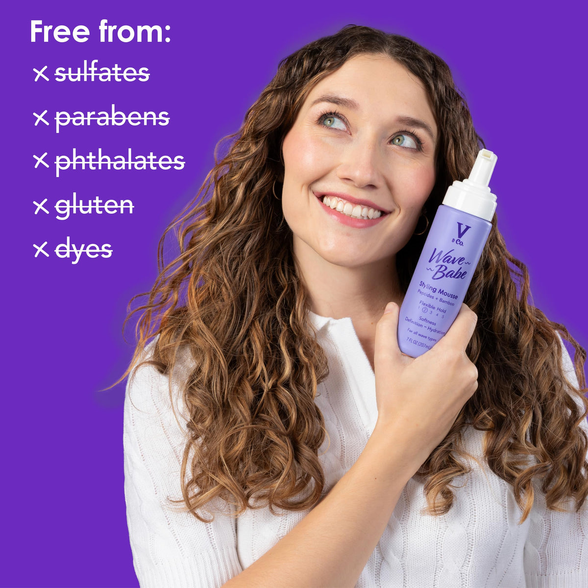 V&CO Wave Babe held in hand demonstrating 7 oz size for travel-friendly convenience