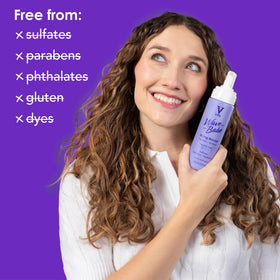 V&CO Wave Babe held in hand demonstrating 7 oz size for travel-friendly convenience