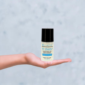 VenActive 2 oz bottle next to purse and dance bag for portable touch-ups