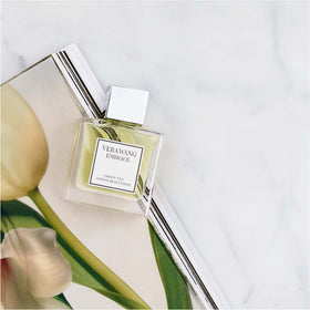 Vera Wang lifestyle image at brunch illustrating fresh floral scent in use