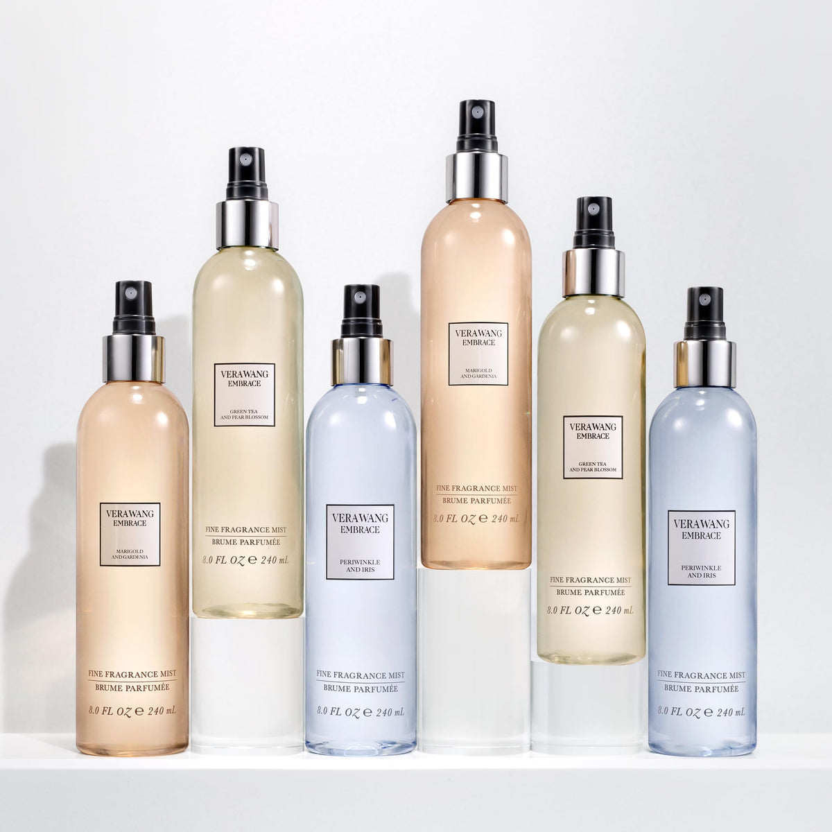 Vera Wang bottle held in hand illustrating 8 fl oz size and portability