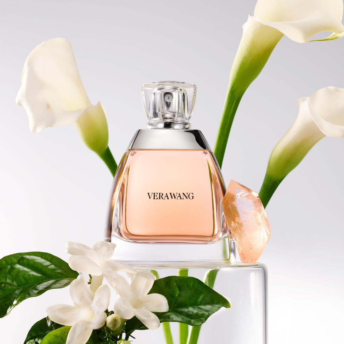 Vera Wang perfume being sprayed on wrist demonstrating easy application and travel use