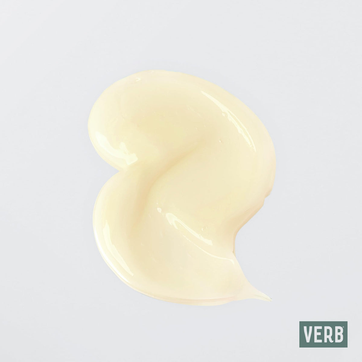 Verb curl cream being applied to damp hair demonstrating easier curl definition