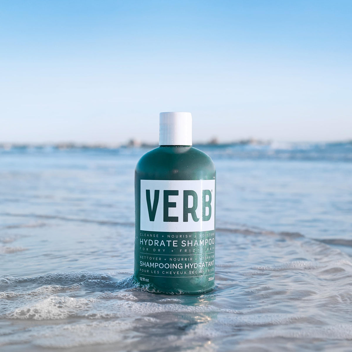 VERB shampoo paired with conditioner on counter showing hydrated hair results