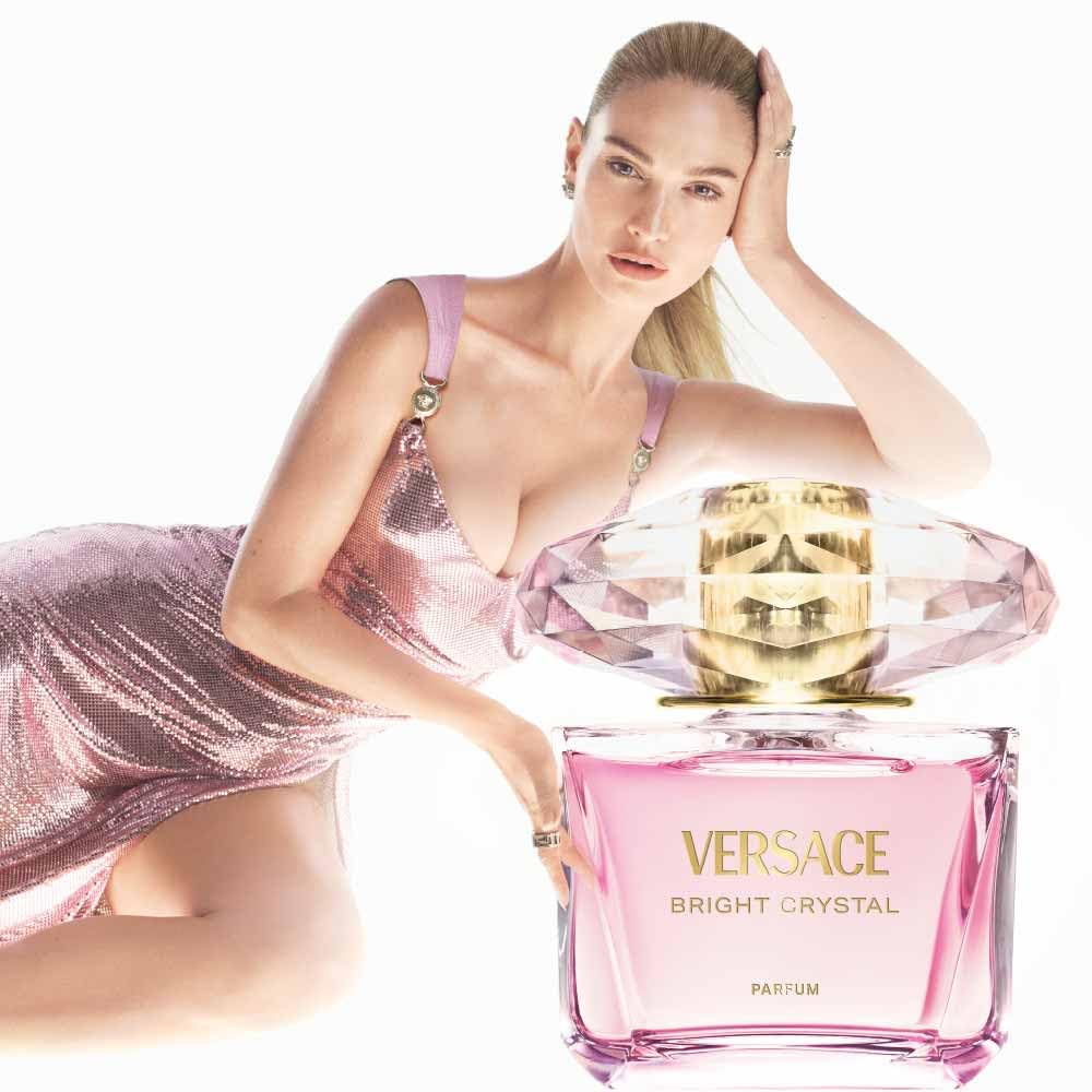 Versace parfum spray in use on wrist demonstrating fine mist and lasting scent