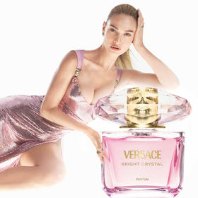 Versace parfum spray in use on wrist demonstrating fine mist and lasting scent