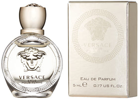 Versace bottle close-up of glass and cap detail, highlighting craftsmanship