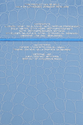Versace label detail highlighting fragrance name and original design