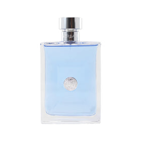 Flat lay of Versace Pour Homme ingredient notes illustrating citrus, floral, and woody accords