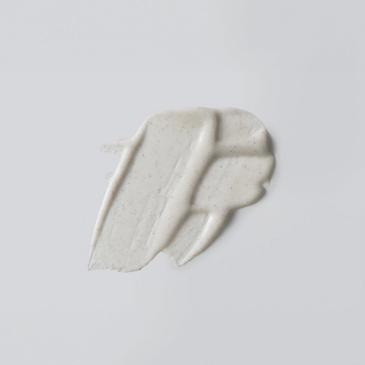 Versed Buff It Out creamy texture close-up highlighting gentle exfoliation