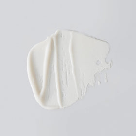 Versed pump dispensing creamy exfoliator, illustrates texture and ease of use for gentle exfoliation