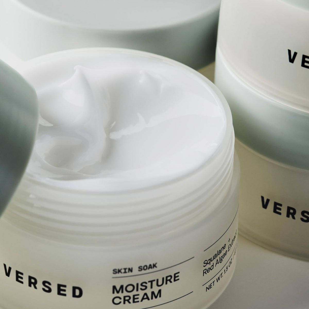 Versed Skin Soak held in hand to show 1.5 oz scale, conveys portable daily moisturizer convenience