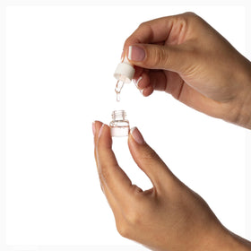 Vessara lip gloss tube detail showing clear applicator for touch-ups
