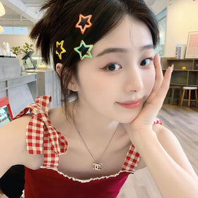 VIBILIA star clips holding bangs back to show makeup and skincare convenience