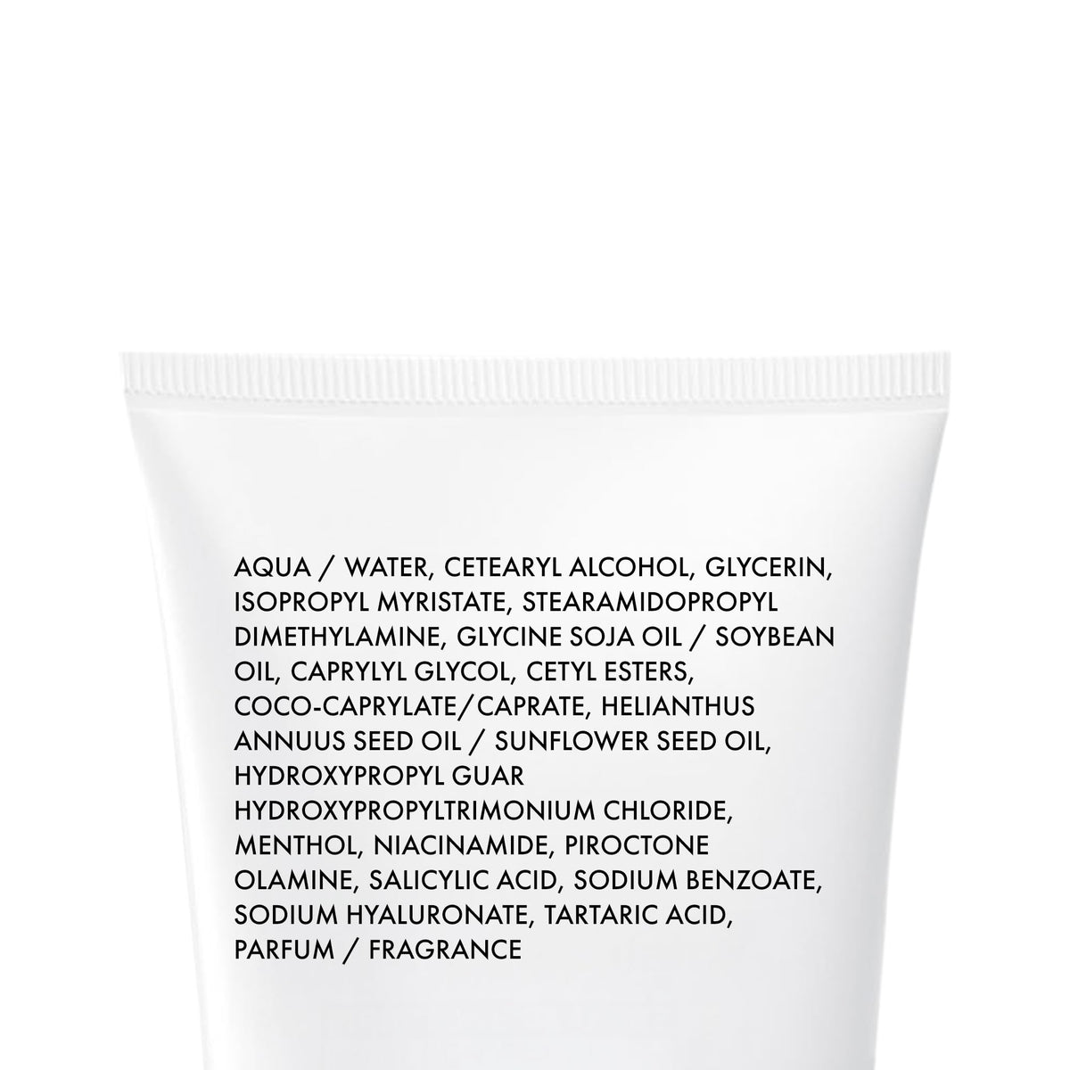 VICHY Dercos bottle next to everyday objects to illustrate 6.7 fl oz travel-friendly size
