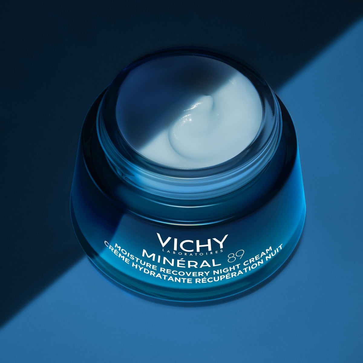 VICHY 50ml jar next to coin for scale to show convenient travel size