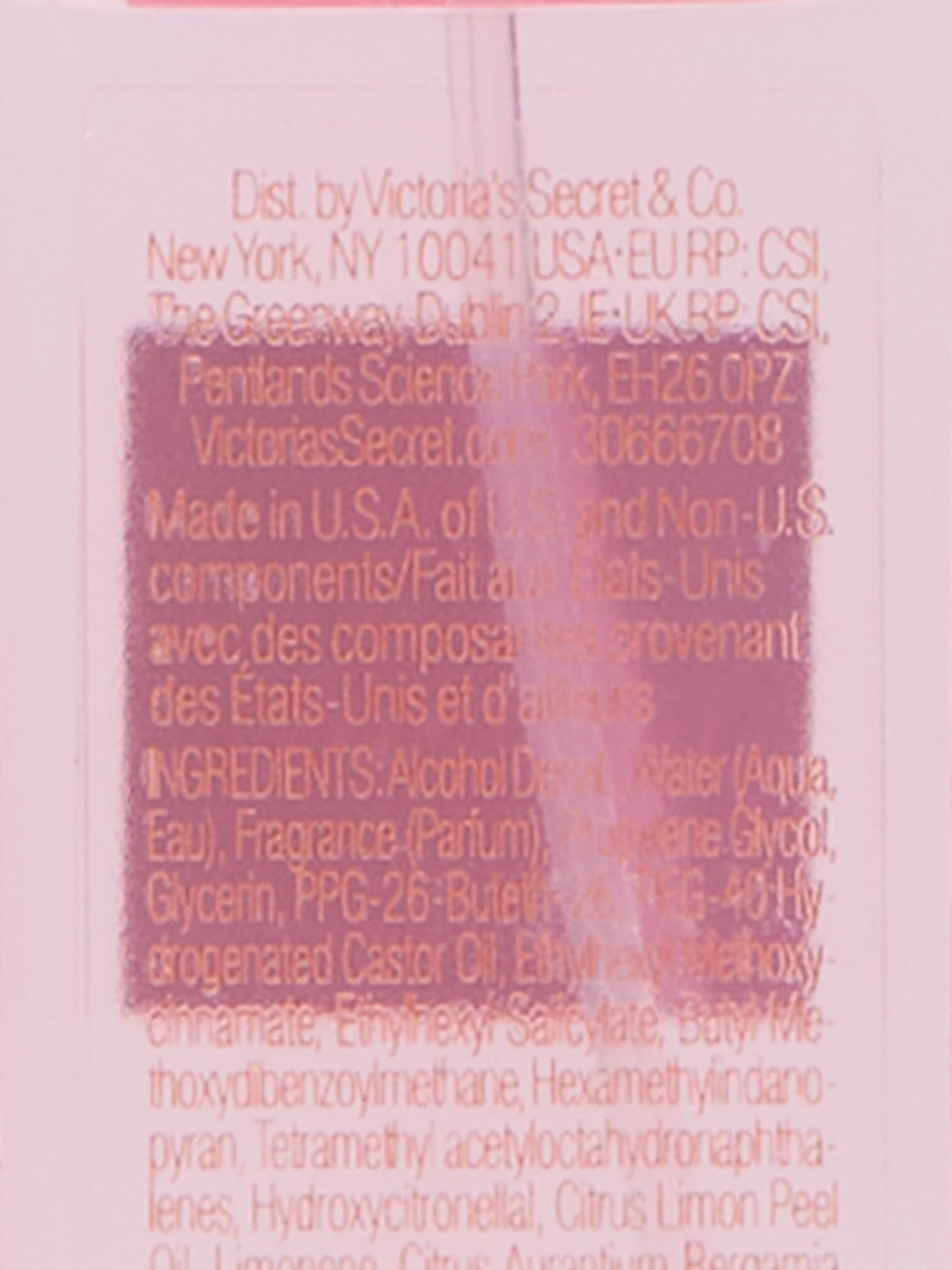 Victoria's Secret Bombshell mini placed in a purse with sunglasses, ideal for on-the-go scent