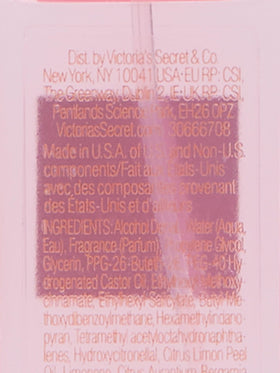 Victoria's Secret Bombshell mini placed in a purse with sunglasses, ideal for on-the-go scent