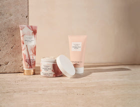 Victoria's Secret lotion in hand to show bottle scale and recommended single-use amount