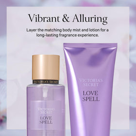 Victoria's Secret Love Spell bottle held beside hand to show 8.4 fl oz scale