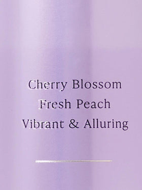 Victoria's Secret Love Spell mist on skin illustrating lightweight, non-greasy finish