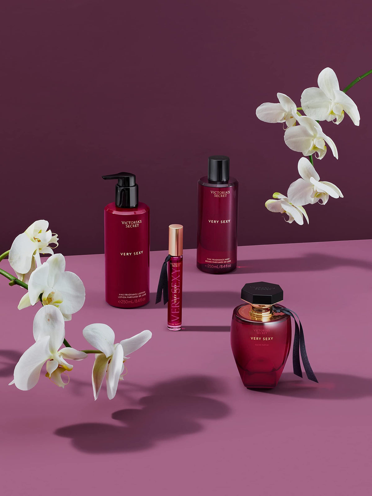 Victoria's Secret bottle on a vanity with styled accessories benefit: lifestyle presentation
