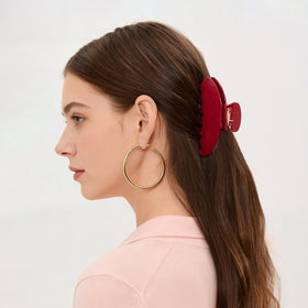 Vigorpace in hair bun styling demonstrating secure updo and comfortable wear benefit