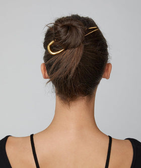 Vigorpace hair pins securing a bun demonstrating secure updo hold