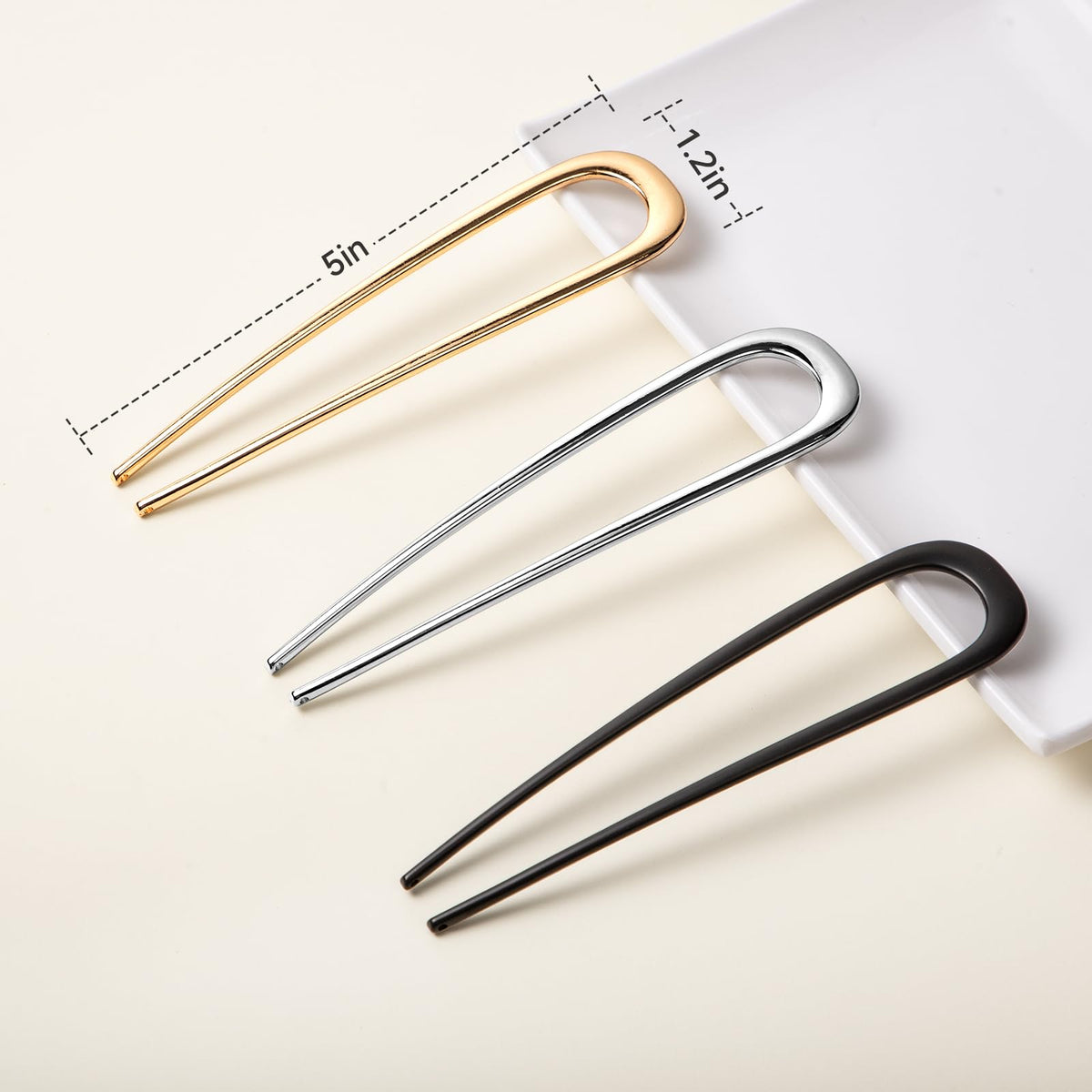 Vigorpace pins beside a ruler showing compact size and precise styling control