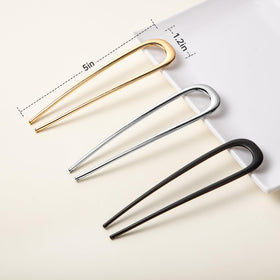 Vigorpace pins beside a ruler showing compact size and precise styling control