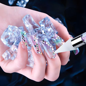 Vikerer in use on nail demonstrating accurate gem placement for polished results