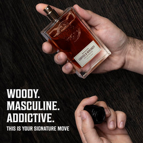 Viking Revolution amber bottle placed on wood surface suggesting smoky, earthy scent benefits