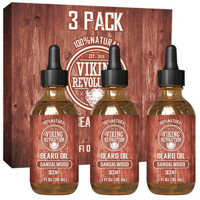 Viking Revolution front packaging showing three sandalwood beard oil bottles and benefit of grooming