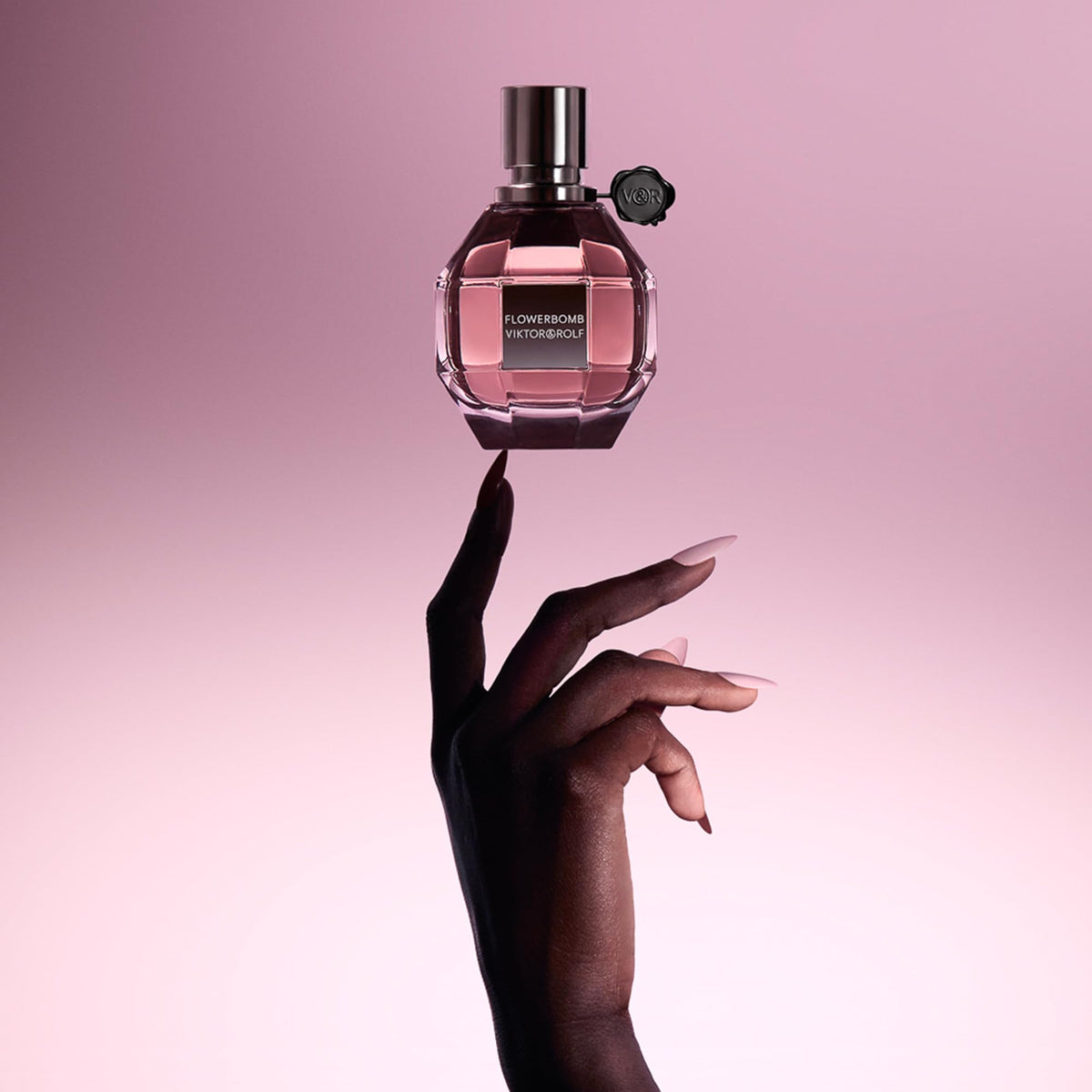 Viktor&Rolf Flowerbomb spray in use on wrist demonstrating easy daytime refresh