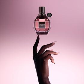 Viktor&Rolf Flowerbomb spray in use on wrist demonstrating easy daytime refresh