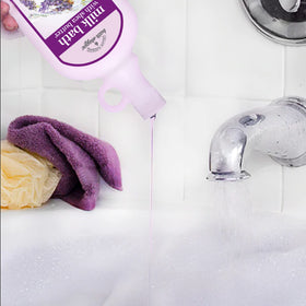 Village Naturals in-use tub scene with lavender chamomile scent promoting relaxation