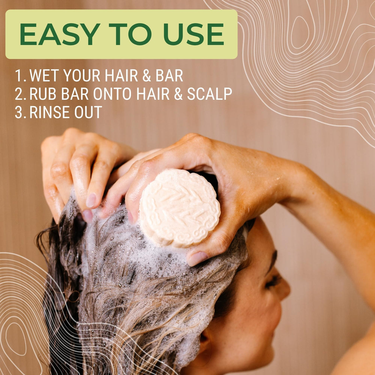 Viori shampoo bar held in hand to show compact travel-friendly size