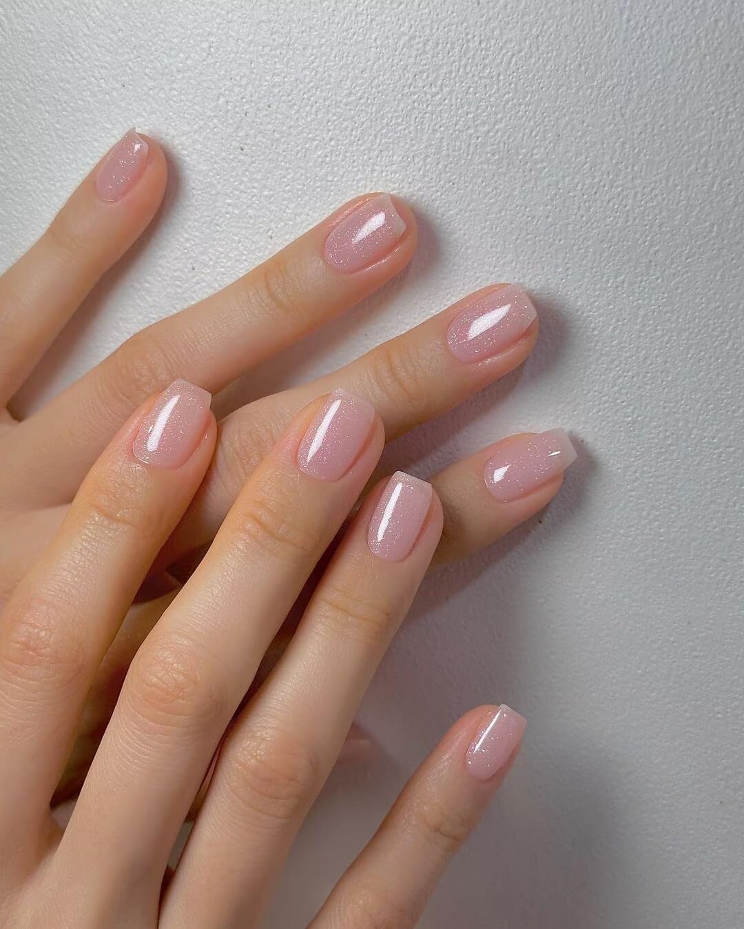 Vishine swatch on natural nails demonstrating flattering nude-pink finish