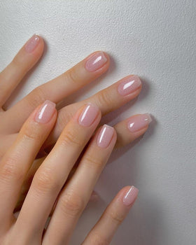 Vishine swatch on natural nails demonstrating flattering nude-pink finish