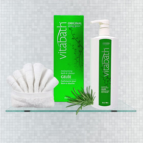Close-up of botanical extracts beside Vitabath bottle showing natural ingredient benefit