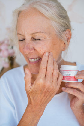 Vitality tin beside everyday items showing compact size and portable skin-care convenience
