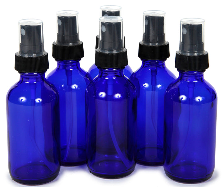 Vivaplex front view of six cobalt blue bottles showing travel-ready set and UV protection