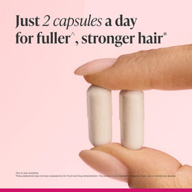 bathroom counter with Viviscal bottle integrated into haircare routine for convenience