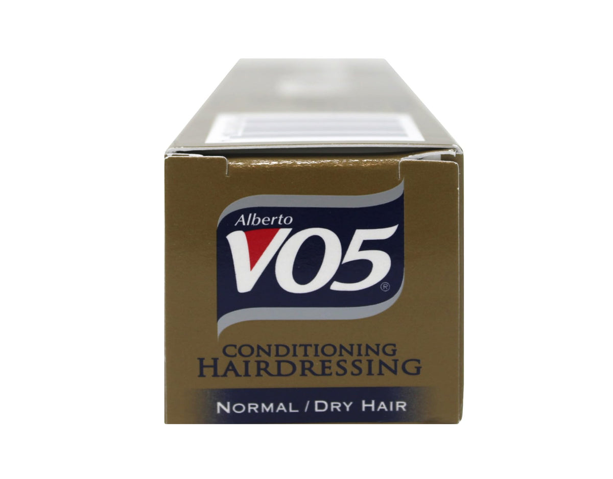 VO5 applied to hair ends in styling use demonstrating frizz control benefit