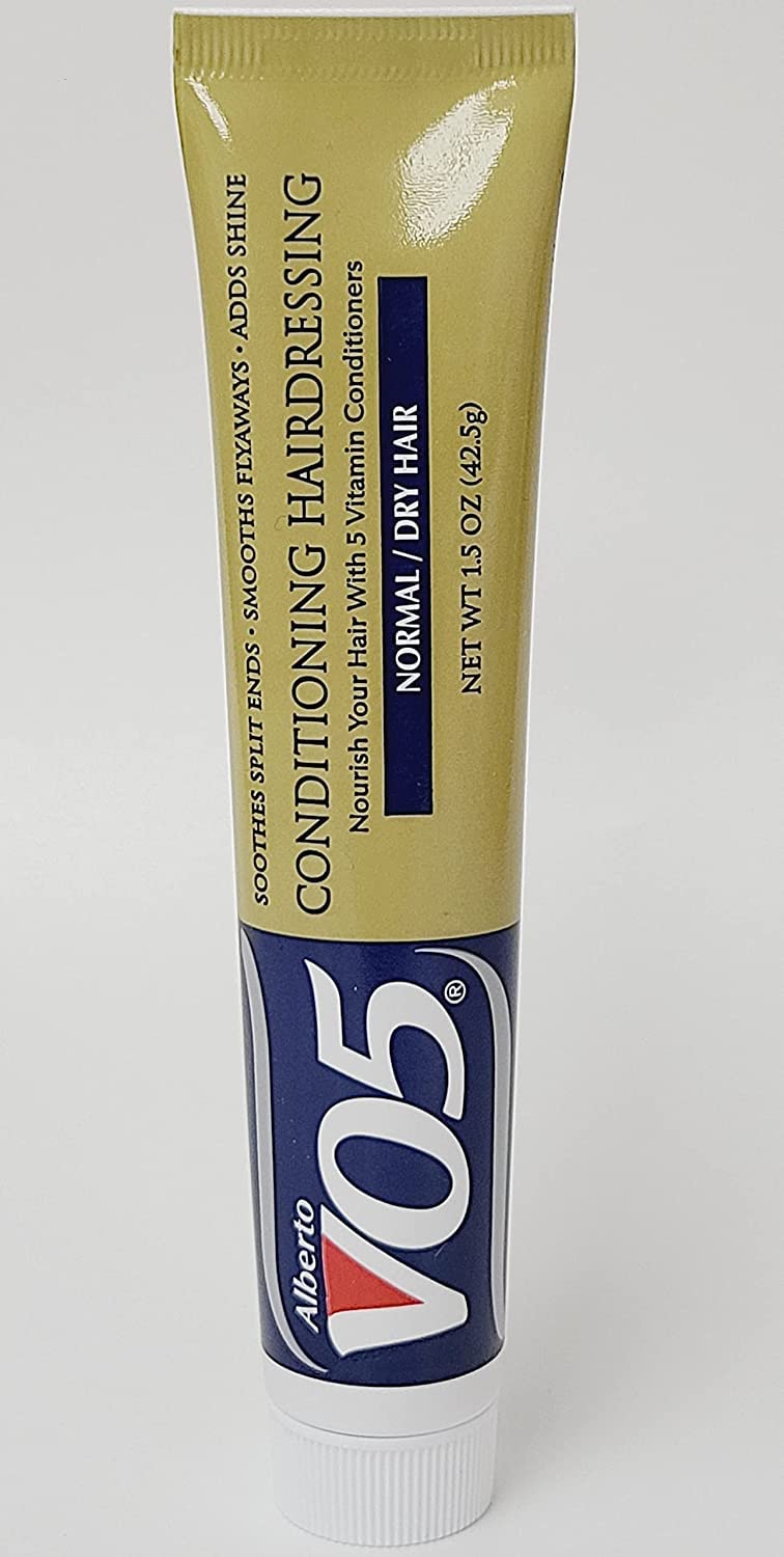 VO5 creamy conditioner texture dispensed to show lightweight moisturizing formula