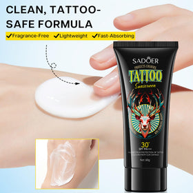 VRAIKO in a beach setting protecting tattoos during outdoor activity and water exposure