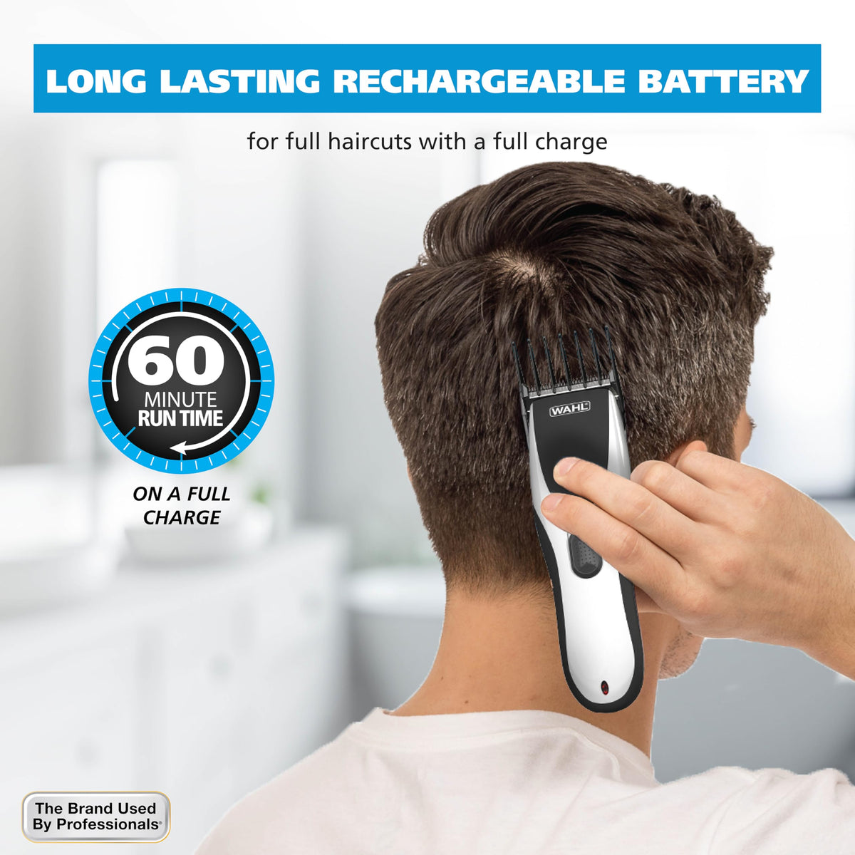 Wahl charging cord and dock beside clipper indicating corded backup and recharging