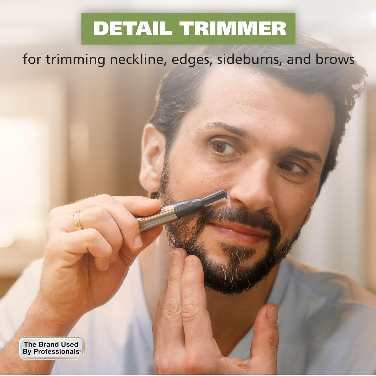 Wahl trimmer held in hand to show compact size and ergonomic control